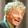 Playing a duet with his younger self (projected on a screen) is part of the nostalgic appeal Barry Manilow brings to his show at the Las Vegas Hilton. Manilow returns to the city with a repertoire of hits from past decades.