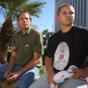 Jim Erbes and his son Andy, 13, of Scottsdale, Ariz., take a break from touring Las Vegas at the corner of the Strip and Tropicana Avenue on Monday. Erbes, a retired university professor, said the family had considered a trip to the Dominican Republic but decided to vacation closer to home because of the economic downturn.