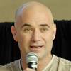 Andre Agassi, seen here at graduation for the Class of 2011 at the Andre Agassi College Preparatory Academy, is focusing some of his energy on inspiring the students and helping promote the school.