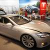 This June 22, 2012, photo shows a Tesla Model S electric sedan outside the Tesla factory in Fremont, Calif.