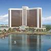This artist's rendering released Wednesday, March 27, 2013, by Wynn Resorts shows a proposed resort casino on the banks of the Mystic River in Everett, Mass.