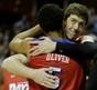 Dayton's Devin Oliver (5) embraces Matt Kavanaugh after the second half in a regional final game against Florida at the NCAA college basketball tournament, Saturday, March 29, 2014, in Memphis, Tenn. Florida won 62-52. (Mark Humphrey/AP)