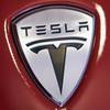 Tesla Motors unveils the new, lower-priced Model 3 sedan at the Tesla Motors design studio Thursday, March 31, 2016, in Hawthorne, Calif.