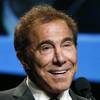 Steve Wynn, right, chairman and CEO of Wynn Resorts, waits to be introduced at the Electronics For Imaging conference at Wynn Las Vegas, Tuesday, Jan. 19, 2016. Wynn recently hosted a get-together for Karl Rove and Donald Trump at his Manhattan home.