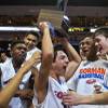 Bishop Gorman players celebrate their trophy after beating Palo Verde in the Division I state basketball championship on Friday, Feb. 27, 2015.