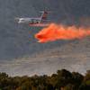 A plane drops fire retardant on the Mahogany fire at Mount Charleston, Monday, June 29, 2020. .