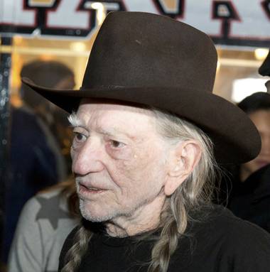 With burning joints raised high, about 200 marijuana industry employees and representatives celebrated the arrival of country music legend and marijuana advocate Willie Nelson on ...