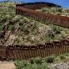 In this March 13, 2018, file photo, President Donald Trump talks with reporters as he reviews border wall prototypes in San Diego. In this March 13, 2018, file photo, President Donald Trump talks with reporters as he reviews border wall prototypes in San Diego.