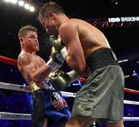 WBC/WBA/IBF middleweight champion Grennady Golovkin, left, of Kazakhstan and Canelo Alvarez of Mexico celebrate after a 12-round title fight at T-Mobile Saturday Saturday, Sept. 16, 2017.