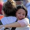 Kaitlynn Cooper, 12, facing, hugs her friend Allison Shonk, 18, a student at Marjory Stoneman Douglas High School, during a vigil at the Parkland Baptist Church, in Parkland, Fla., Thursday, Feb. 15, 2018. Nikolas Cruz, a former student, was charged with 17 counts of premeditated murder Thursday morning. Kaitlynn Cooper, 12, facing, hugs her friend Allison Shonk, 18, a student at Marjory Stoneman Douglas High School, during a vigil at the Parkland Baptist Church, in Parkland, Fla., Thursday, Feb. 15, 2018. Nikolas Cruz, a former student, was charged with 17 counts of premeditated murder Thursday morning.