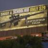 Indecline, an activist art collective, says it altered this billboard for a Las Vegas gun range on Thursday, March, 1, 2018, to call attention to the need for gun control following mass shootings in Las Vegas and Florida.