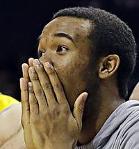 UMBC players celebrate a teammate's basket against Virginia during the second half of a first-round game in the NCAA men's college basketball tournament in Charlotte, N.C., Friday, March 16, 2018. 