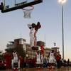 UNLV Rebel Amauri Hardy (3) dunks the ball as players warm up for an exhibition in the parking lot of Sam Boyd Stadium before the UNLV-Air Force football game Friday, Oct. 19, 2018. UNLV Rebel Amauri Hardy (3) dunks the ball as players warm up for an exhibition in the parking lot of Sam Boyd Stadium before the UNLV-Air Force football game Friday, Oct. 19, 2018.