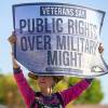 George Killingsworth, right, of Berkeley, Calif., pickets with Fred Bialy, center, of San Francisco at the main entrance to Nellis Air Force Base Thursday, Oct. 3, 2019. Caroline Davies, left, of Phoenix talks with a driver leaving the base. Veterans for Peace, Code Pink, and other groups are opposed to a plan that would expand the Nevada Test and Training Range into the Desert National Wildlife Refuge.