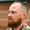 This August 2019 photo provided by the Nevada Army National Guard shows Sgt. 1st Class Benjamin Hopper of the Nevada Army National Guard at a deployment ceremony in Nevada. Hopper, who is serving in Afghanistan, received a uniform religious exemption to sport a beard based on his Norse pagan beliefs. He is the first guard soldier to receive a religious accommodation for a beard.