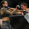 Amanda Nunes, left, fights Julianna Pena during a women's bantamweight mixed martial arts title bout at UFC 269, Saturday, Dec. 11, 2021, in Las Vegas.