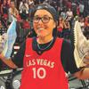 Ashleigh Ahrens displays a pair of game-worn shoes given to her by Las Vegas Aces star guard Kelsey Plum after a playoff game last month.