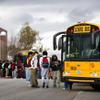 Students wait to board a school bus at Arbor View High School in Las Vegas Thursday, Jan. 5, 2023.