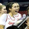 UNLV Lady Rebels guard Essence Booker, left, Alyssa Durazo-Frescas (12) and Desi-Rae Young (23) celebrate with the Mountain West trophy after defeating the San Jose State Spartans at the Thomas & Mack Center in Las Vegas Thursday, Feb. 16, 2023.