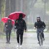 Rain falls on pedestrians on the University of Southern California campus on Tuesday, March 21, 2023, in Los Angeles. 
