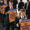 Members of the Air Line Pilots Association International walk an informational picket on behalf of United Airline pilots at O'Hare International Airport Friday, May 12, 2023, in Chicago.
