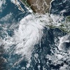 This satellite image taken at 10:50am EDT on Thursday, Aug. 17, 2023, and provided by the National Oceanic and Atmospheric Administration (NOAA) shows Hurricane Hilary off the Pacific coast of Mexico.
