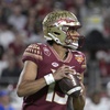 Florida State quarterback Jordan Travis (13) looks for a receiver during the first half of the Cheez-It Bowl NCAA college football game against Oklahoma, Thursday, Dec. 29, 2022, in Orlando, Fla.