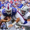 Las Vegas Raiders' Maxx Crosby (98) and Marcus Epps (1) tackle Buffalo Bills quarterback Josh Allen (17) during the first half of an NFL football game, Sunday, Sept. 17, 2023, in Orchard Park, N.Y. (AP Photo/Jeffrey T. Barnes)