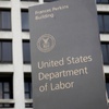 A sign stands outside the U.S. Department of Labor's headquarters, May 6, 2020, in Washington.