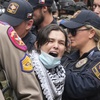 A woman is arrested at a pro-Palestinian protest at the University of Texas, Wednesday, April 24, 2024, in Austin. 