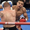 Junior middleweight champion Jaime Munguia throws a right at Brandon Cook during their fight Saturday, September 15, 2018, at T-Mobile Arena. Munguia won with a second round TKO to retain his title.