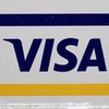 A Visa sign is displayed on the front door of a local business, April 27, 2021, in Urbandale, Iowa.
