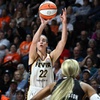 Indiana Fever guard Caitlin Clark (22) puts up a 3-point shot to score against the Connecticut Sun during the fourth quarter of a WNBA basketball game, Tuesday, May 14, 2024, in Uncasville, Conn.
