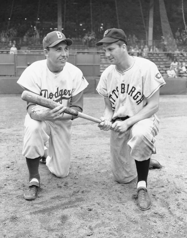 In this July 23, 1951 file photo, Gil Hodges, left, and Ralph Kiner pose. The baseball Hall of Fame says slugger Ralph Kiner has died. He was 91. The Hall says Kiner died Thursday, Feb. 6, 2014, at his home in Rancho Mirage, Calif.