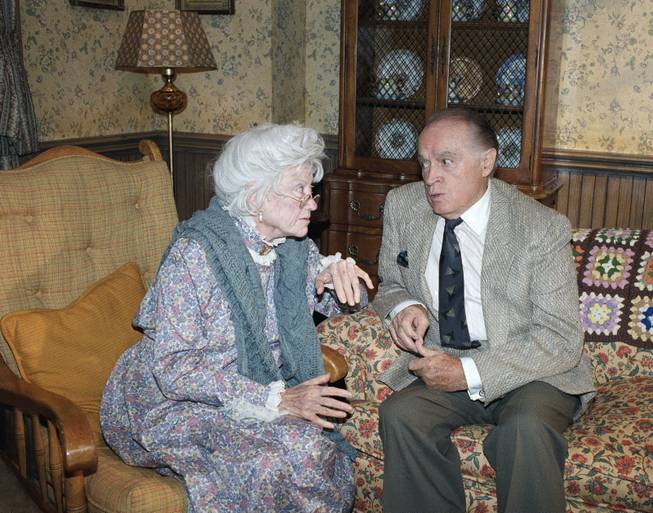 Comedian Bob Hope and Phyllis Diller pause during a break in taping of iStand by for HNN. The Hope (Funny) News Network,i which will air on NBC-TV on Sept. 8. Hope is interviewing Diller who is portraying a 131-year-old woman n ithe oldest person in the world.i in Burbank, California on Sept. 3, 1988. 