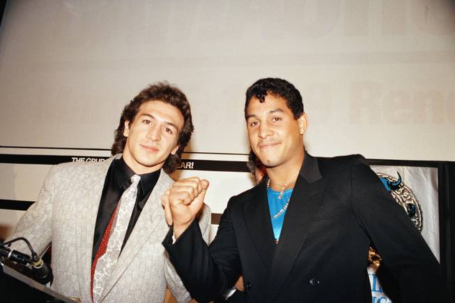 Ray "Boom Boom" Mancini, left and Hector "Macho" Camacho take the typical pose after holding a news conference in New York City, Dec. 19, 1988. They announced their "grudge fight" in Reno, Nevada for March 6.