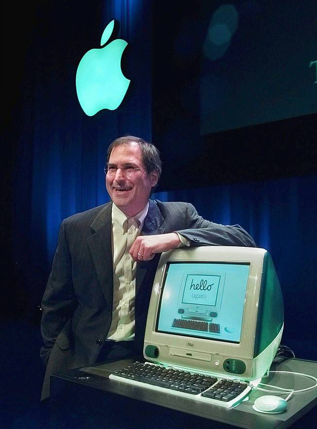 In this May 6, 1998, file photo, Steve Jobs of Apple Computers unveils the the new iMac computer in Cupertino, Calif. Apple on Wednesday, Oct. 5, 2011 said Jobs has died. He was 56.