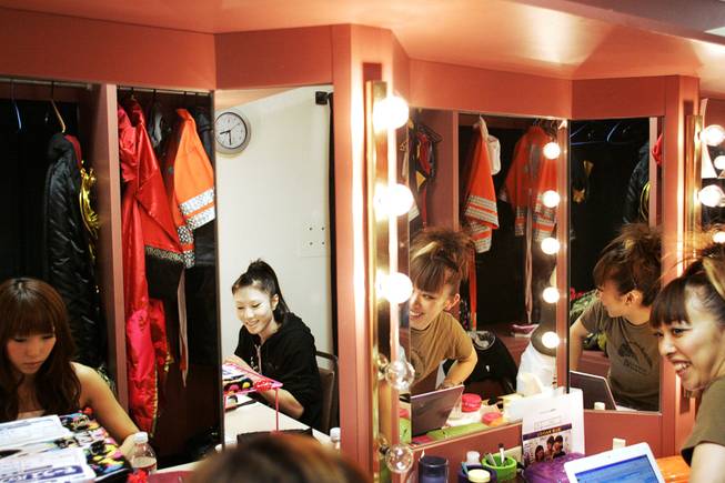Reflected in their dressing room mirrors, 