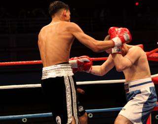 Jose Benavidez Jr. throws a punch at Steven Cox in their super lightweight fight Saturday at the Joint inside the Hard Rock. Benavidez Jr. won by TKO in the first round.