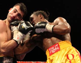 Kassim Ouma throws a punch at Vanes Martiosyan during their NABO/NABF super welterweight title fight Saturday at the Joint inside the Hard Rock. Martiosyan won the fight by unanimous decision.