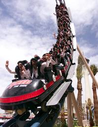 Twenty-four members of the parachute team The Flying Elvi take the ceremonial first trip on the new rollercoaster Speed - The Ride at the Sahara on April 28, 2000.