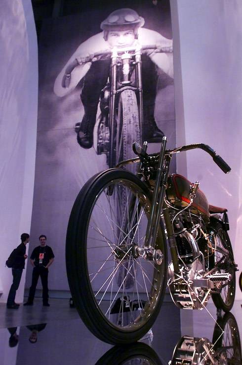 Invited guests look over a 1923 Harley Davidson 8-valve Board Track Racer motorcycle during a preview of the Guggenheim Las Vegas museum at The Venetian hotel-casino Thursday, October 4, 2001. The inaugural exhibit at the new museum is "The Art of the Motorcycle".  The 63, 700 sq. ft. exhibition hall opens to the public Sunday.