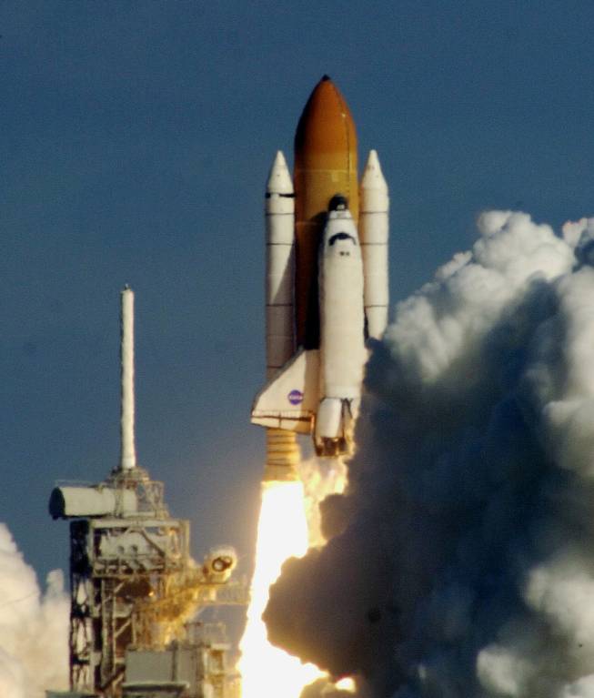 The space shuttle Columbia clears the pad on way to orbit after liftoff at the Kennedy Space Center in Cape Canaveral, Fla. in this Thursday Jan. 16, 2003 photo. Shortly after Columbia lifted off, a piece of insulating foam on its external fuel tank came off and was believed to have hit the left wing of the shuttle. Leroy Cain, the lead flight director in Mission Control, assured reporters Friday, Jan. 31, 2003, that engineers had concluded that any damage to the wing was considered minor and posed no safety hazard. 