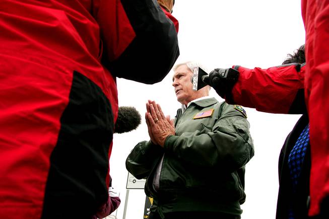 Governor Kenny Guinn briefs the media after flying over the flooded areas of Overton Thursday, January 13, 2005.