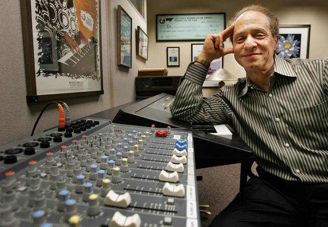 Author and inventor Ray Kurzweil, 56, sits in front of a music mixing board in his office, in Wellesley, Mass., Jan. 12, 2005. 