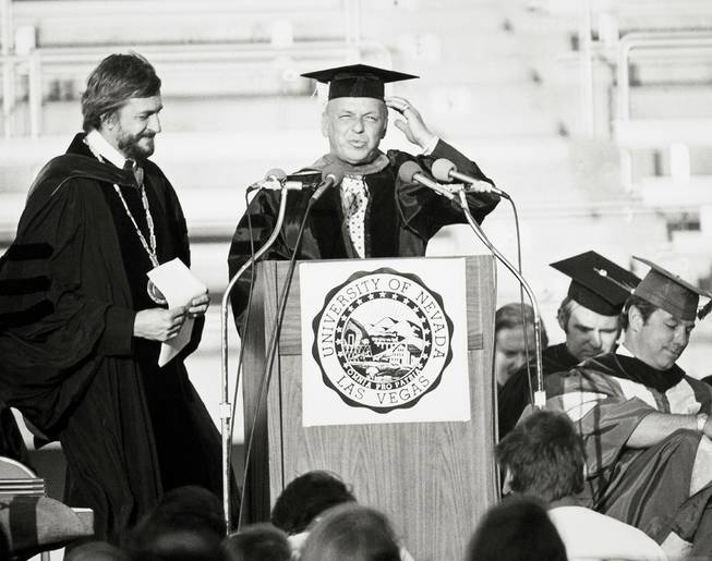 Frank Sinatra receives an honorary doctorate from UNLV President Donald Baepler during the 1976 commencement.