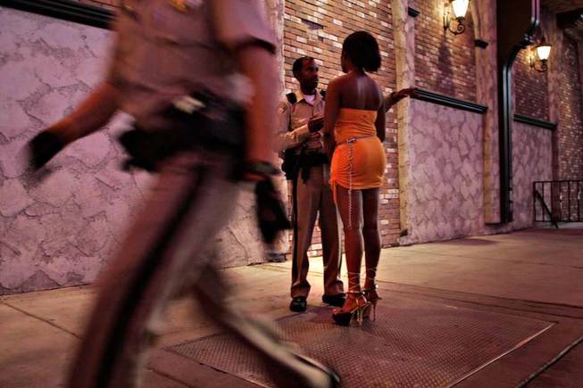 The Las Vegas Metropolitan Police Department carries out a highly visible arrest saturation targeting prostitution on the Las Vegas Strip late night in June 2006.