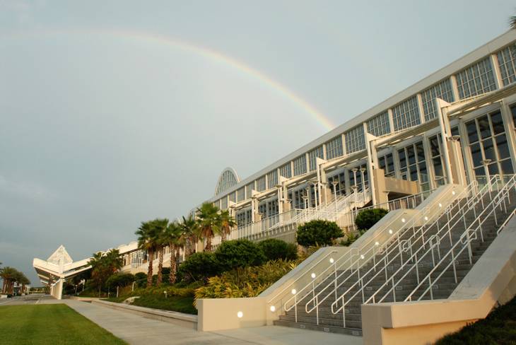 A rainbow shines over the new Orange County Convention Center in Orlando, Fla., Wednesday, Aug. 23, 2006. Orlando business and tourism officials are set to launch a new ad campaign to lure more visitors to the region.