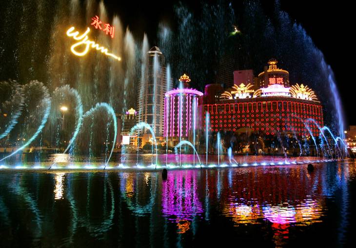 The fountain of the Wynn Macau casino performs celebrating its opening with the backgroung of the Lisboa Casino in Macau, Tuesday, Sept. 5, 2006. American gaming mogul Stephen Wynn was ready to throw open the doors of his new US$1.2 billion casino to gamblers Wednesday in Macau _ the Chinese territory that's rivaling the Las Vegas Strip as the world's epicenter for gambling.  