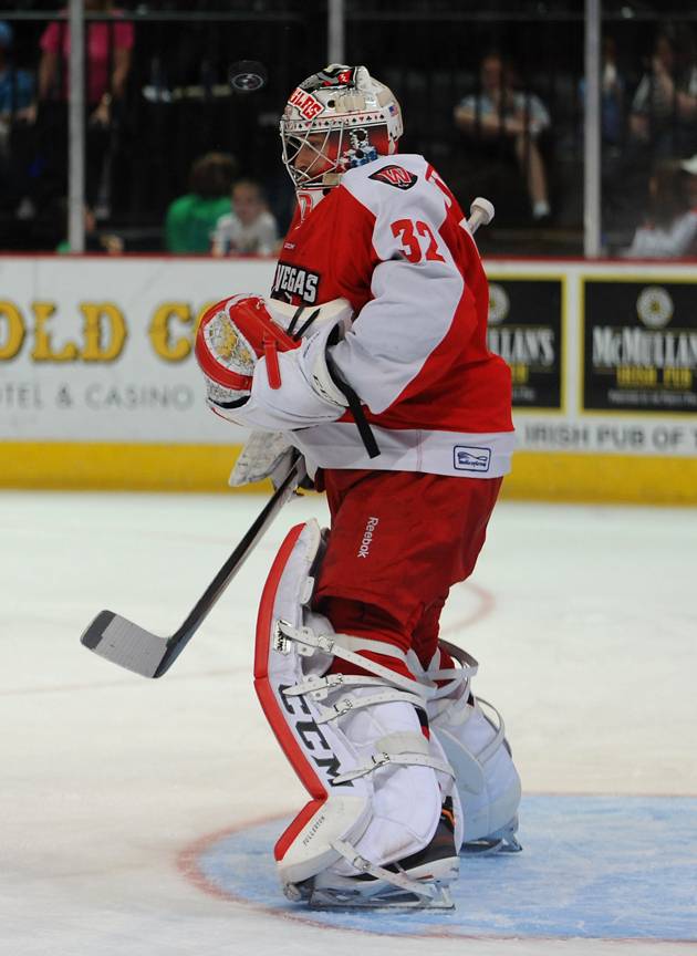 Las Vegas Wranglers goaltender Travis Fullerton stands to stop an Alaska Aces shot during the first period of play on Saturday night at the Orleans Arena.